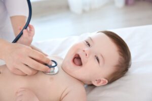 doctor-examining-little-baby-with-stethoscope-clinic-baby-health-concept-300kb-1024x683